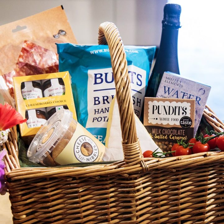 Local wicker picnic hamper with North Devon produce from our farm shop deli in Instow & Appledore. Local Crips, fruits, jam and cheese