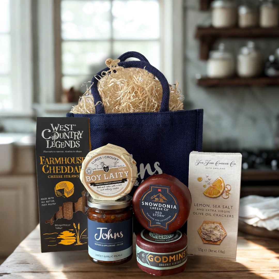 A selection of 3 cheese, crackers, cheese straws and chutney. A perfect gift for any cheese lover!