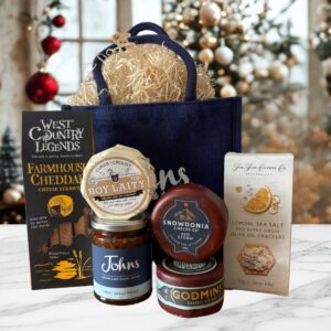 A selection of 3 cheese, crackers, cheese straws and chutney. A perfect gift for any cheese lover!
