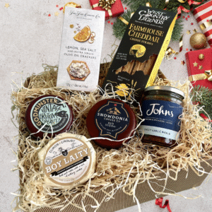 A selection of 3 cheese, crackers, cheese straws and chutney. A perfect gift for any cheese lover!