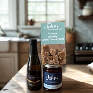 For her treat bag, mini Prosecco, Johns Strawberry & Champagne Jam and local clotted cream fudge. A budget friendly gift that'll be well received.