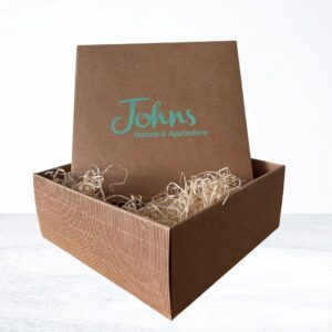 Johns Branded cardboard box. with wood wool. Ideal for filling with you favourite products for a easy gift. Come in store and we can help you choose- for the perfect gift.