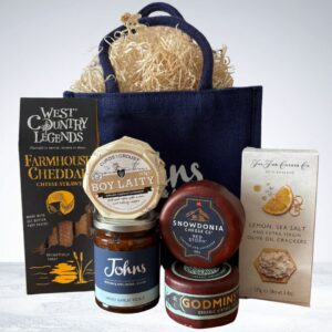 A selection of 3 cheese, crackers, cheese straws and chutney. A perfect gift for any cheese lover!