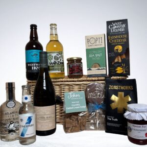 Johns Wicker Hamper packed with a selection of the west countries finest fayre. With Lyme Bay Bacchus Wine, Roastworks Coffee, Waterhouse Fayre Jam, West Country Legends cheese straws, Popti cracker and more its jam packed with goodies